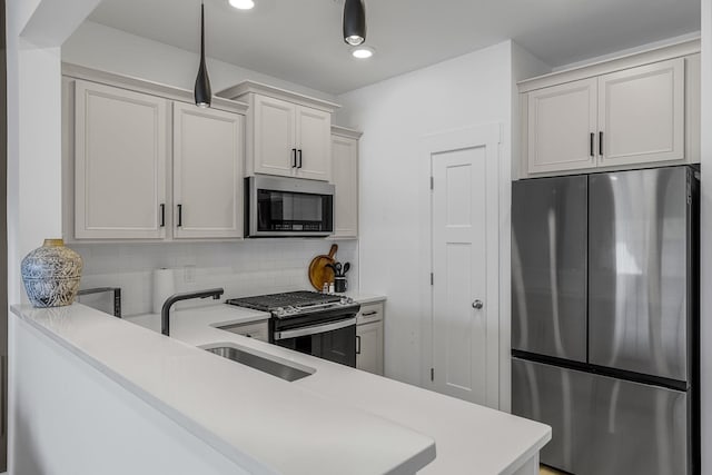 173 Dalmatian, Spartanburg, SC 29307 - kitchen featuring recessed lighting, a sink, tasteful backsplash, light countertops, and appliances with stainless steel finishes