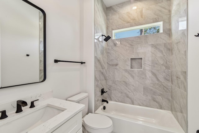bathroom featuring toilet, shower / bath combination, and vanity