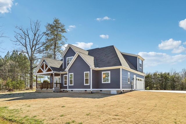 view of home's exterior featuring crawl space, a shingled roof, covered porch, a lawn, and an attached garage