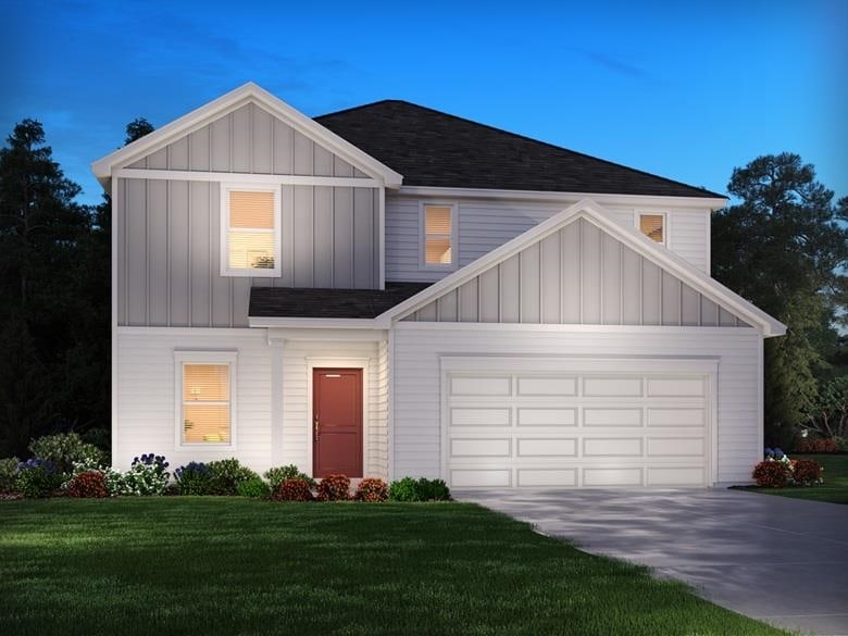 modern farmhouse style home featuring board and batten siding, a shingled roof, a front yard, and concrete driveway
