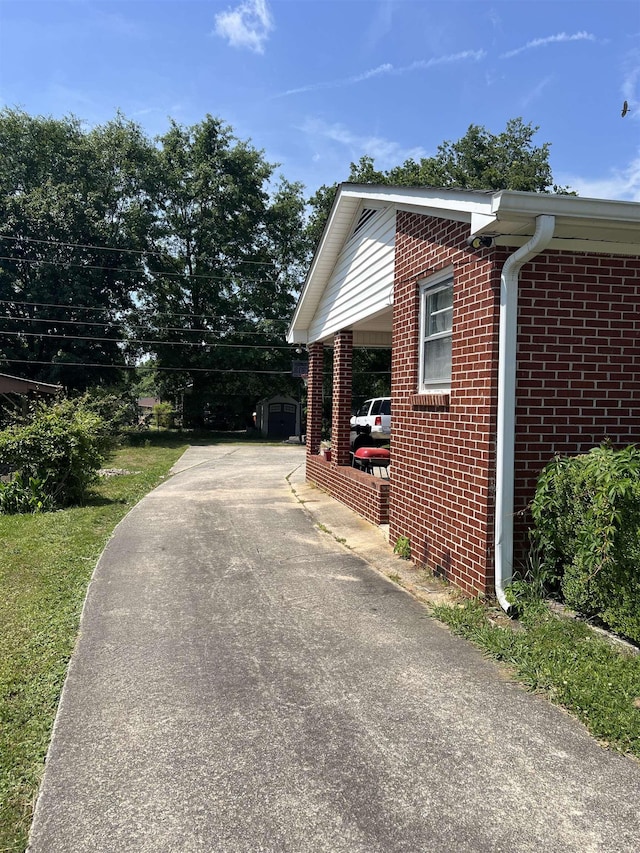 209 Demos, Roebuck, SC 29376 - view of home's exterior featuring concrete driveway, brick siding, and an outbuilding