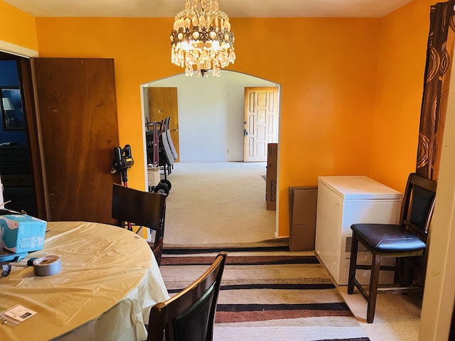 209 Demos, Roebuck, SC 29376 - dining space featuring carpet flooring, arched walkways, and a notable chandelier