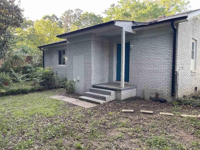 view of home's exterior featuring brick siding