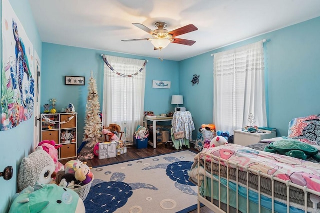 bedroom with a ceiling fan and wood finished floors