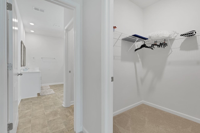 walk in closet with visible vents