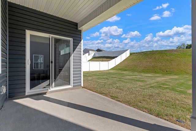 view of patio featuring fence