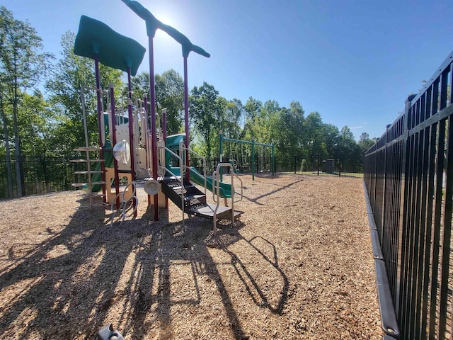 communal playground featuring fence