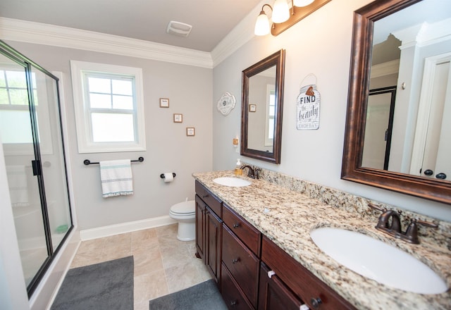 bathroom with ornamental molding, a sink, and a stall shower