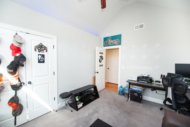 carpeted office space with visible vents, baseboards, ceiling fan, and high vaulted ceiling