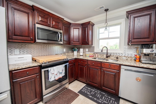 kitchen featuring visible vents, a sink, decorative backsplash, and appliances with stainless steel finishes