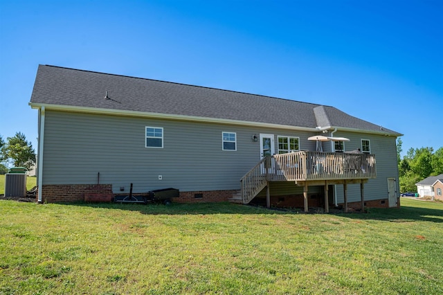 rear view of house featuring crawl space, a wooden deck, a yard, and stairway