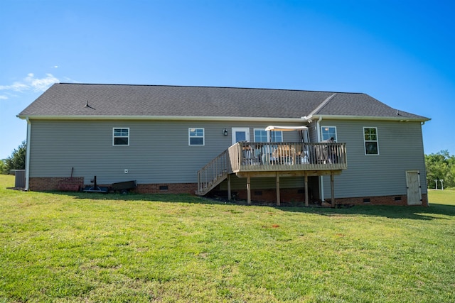 rear view of house with stairs, a lawn, a wooden deck, and crawl space