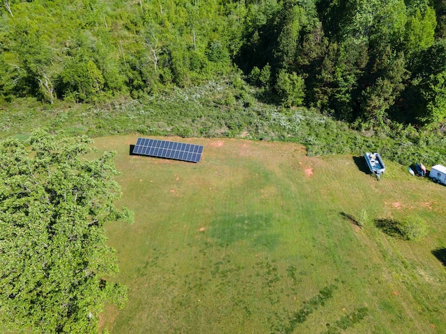 aerial view featuring a wooded view