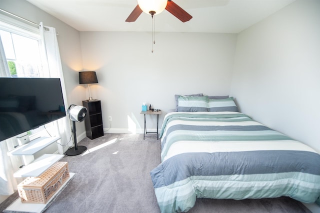 bedroom with carpet flooring, ceiling fan, and baseboards