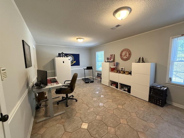 office with crown molding, visible vents, a textured ceiling, and a healthy amount of sunlight