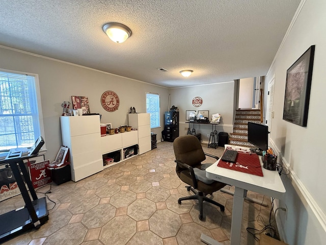 office area featuring ornamental molding and a textured ceiling