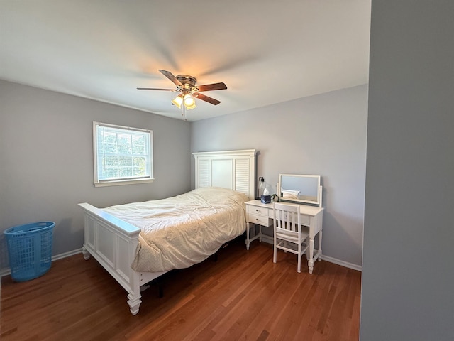 bedroom featuring baseboards, a ceiling fan, and wood finished floors