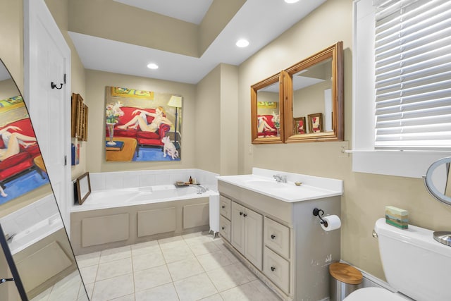bathroom featuring tile patterned flooring, a garden tub, vanity, toilet, and recessed lighting