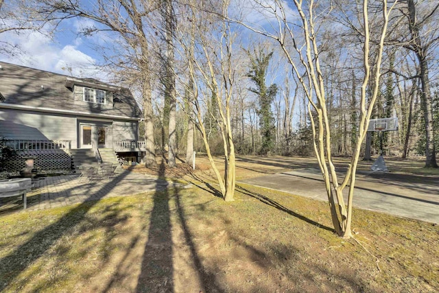 view of yard with a wooden deck