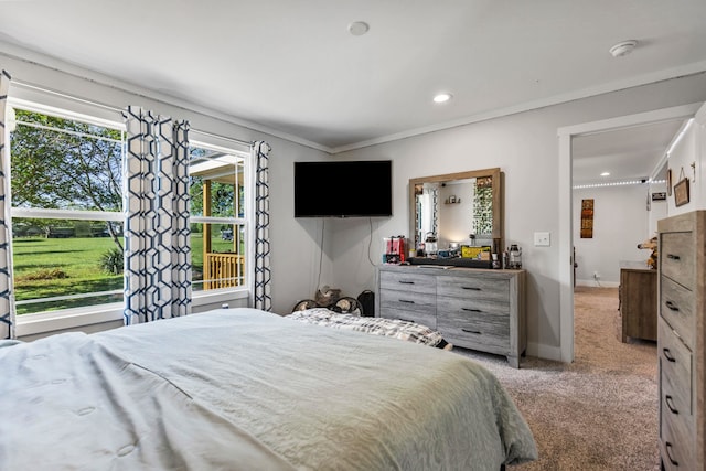 bedroom with recessed lighting, baseboards, light carpet, and ornamental molding