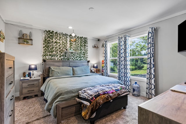 carpeted bedroom with baseboards