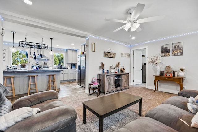 living area with recessed lighting and a ceiling fan