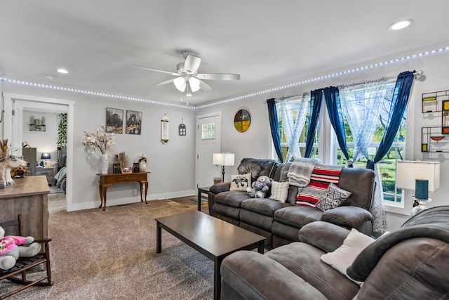 carpeted living area with recessed lighting, a ceiling fan, and baseboards