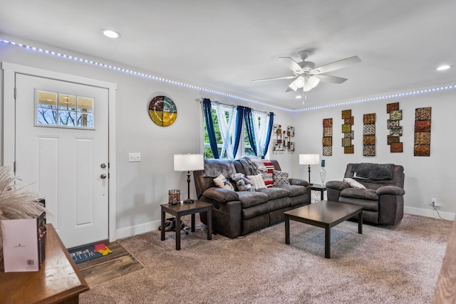 living area with baseboards, a ceiling fan, recessed lighting, and a wealth of natural light