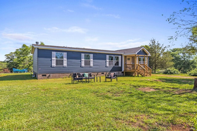 back of house featuring a yard and crawl space