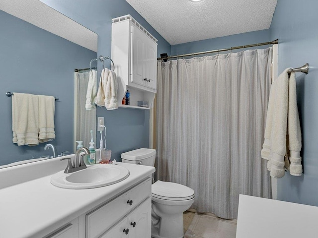 bathroom featuring tile patterned flooring, vanity, toilet, a textured ceiling, and a shower with shower curtain