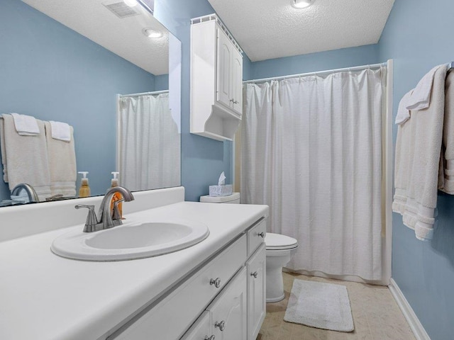 bathroom with vanity, toilet, a textured ceiling, a shower with shower curtain, and visible vents