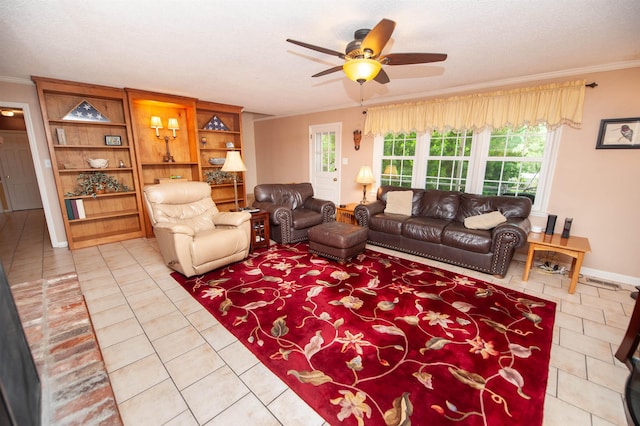 living area with a ceiling fan, light tile patterned flooring, a wealth of natural light, and ornamental molding
