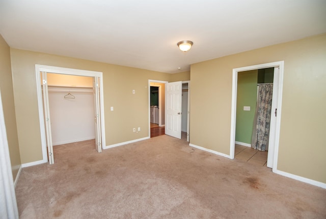 unfurnished bedroom with baseboards and carpet