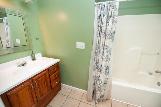 full bath with vanity, shower / tub combo with curtain, baseboards, and tile patterned floors