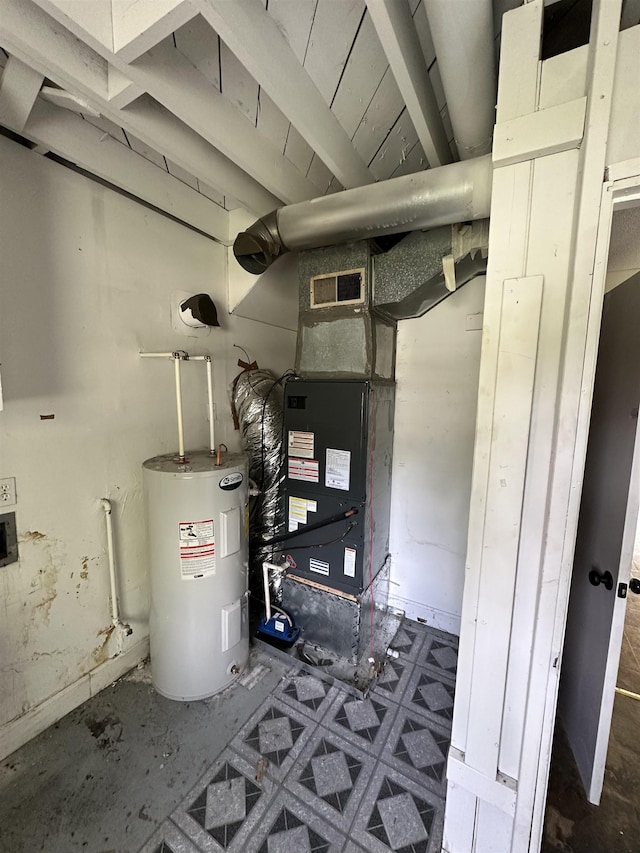 utilities featuring visible vents and electric water heater