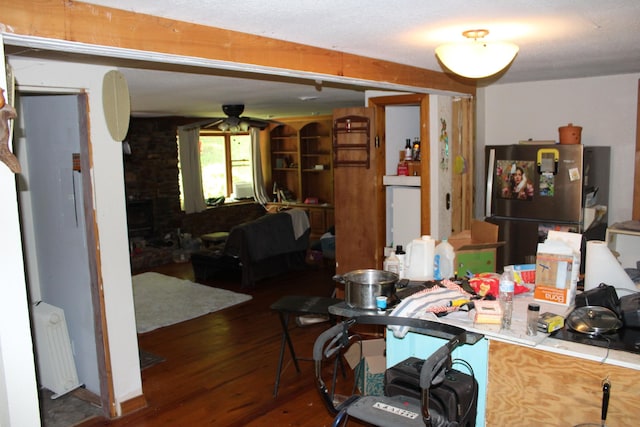 interior space featuring radiator, ceiling fan, and wood finished floors
