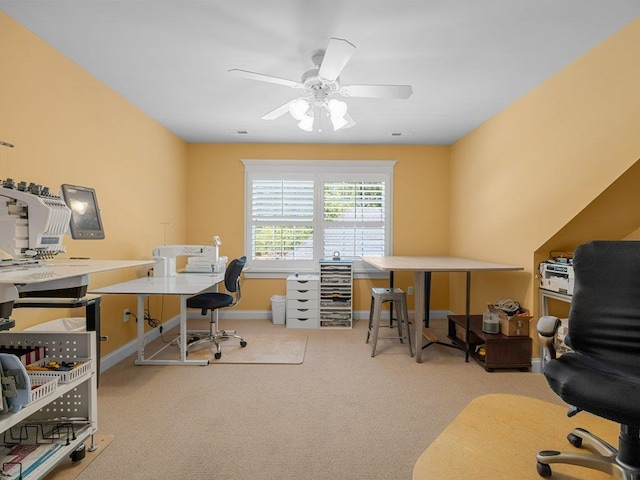 office space with baseboards, ceiling fan, and carpet flooring