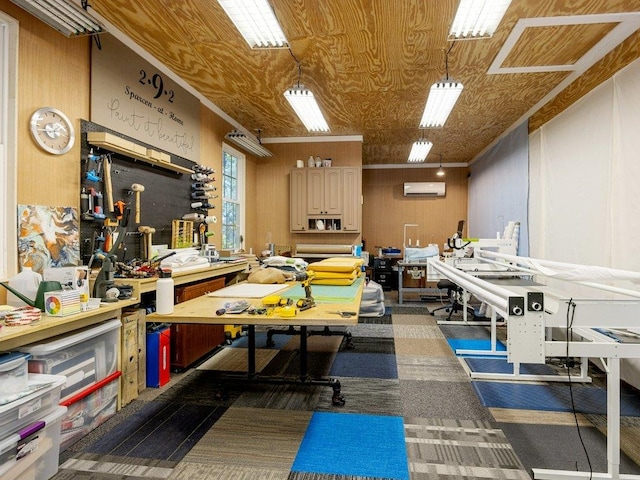 misc room featuring a wall mounted AC, wooden walls, and a workshop area