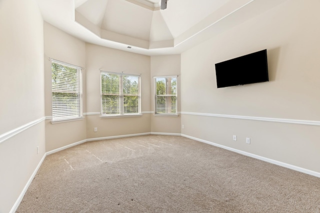 unfurnished room with carpet floors and baseboards