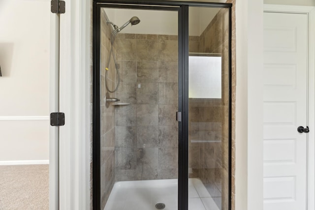full bath featuring a shower stall