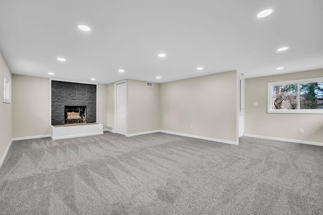103 Forest Hls, Gaffney, SC 29340 - unfurnished living room featuring visible vents, a large fireplace, baseboards, carpet, and recessed lighting