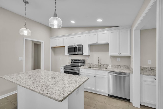 103 Forest Hls, Gaffney, SC 29340 - kitchen featuring a kitchen island, appliances with stainless steel finishes, vaulted ceiling, a sink, and white cabinetry