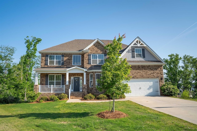 craftsman-style home with a porch, a front yard, brick siding, concrete driveway, and an attached garage