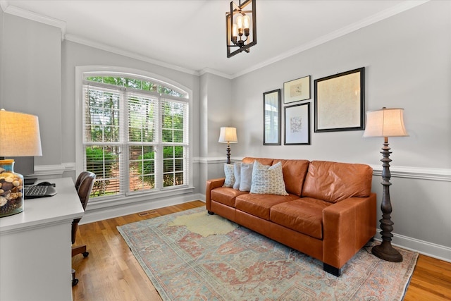 office with an inviting chandelier, crown molding, and wood finished floors