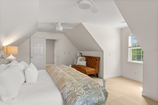 carpeted bedroom with a ceiling fan, baseboards, and lofted ceiling