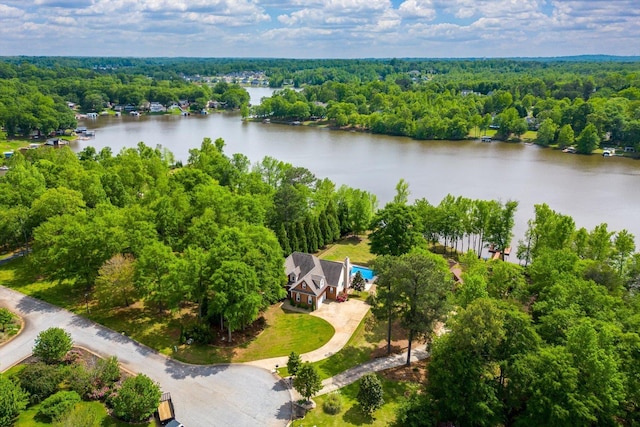 aerial view featuring a water view and a wooded view