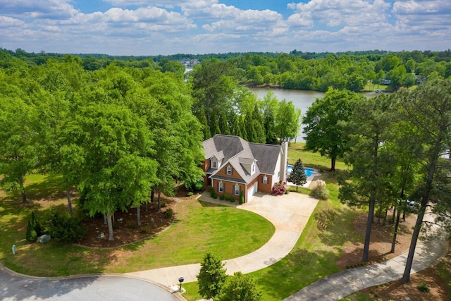 bird's eye view with a water view and a view of trees