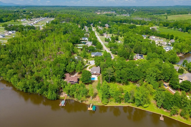 drone / aerial view with a water view and a view of trees