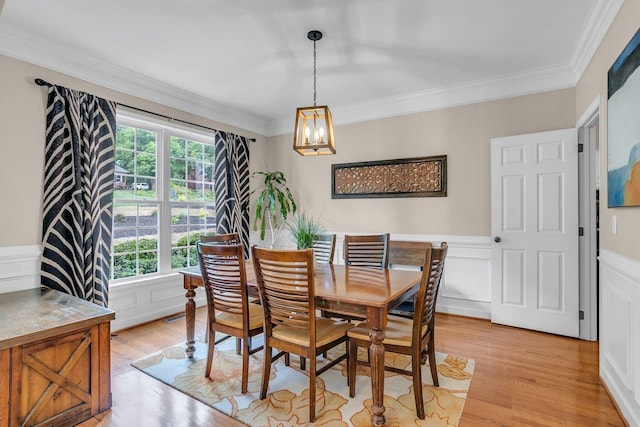 268 Antrim, Moore, SC 29369 - dining area featuring light wood finished floors, a notable chandelier, a wainscoted wall, and a healthy amount of sunlight