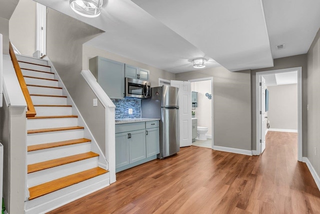 268 Antrim, Moore, SC 29369 - stairway featuring baseboards, wood finished floors, and visible vents